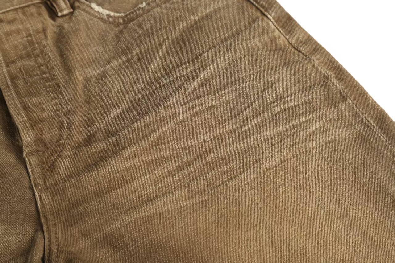 Warm earth tones with fine whiskers and subtle changes around the seams.