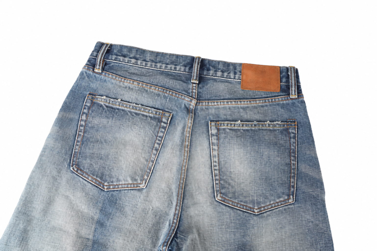 Denim trouser pockets, seams and fading